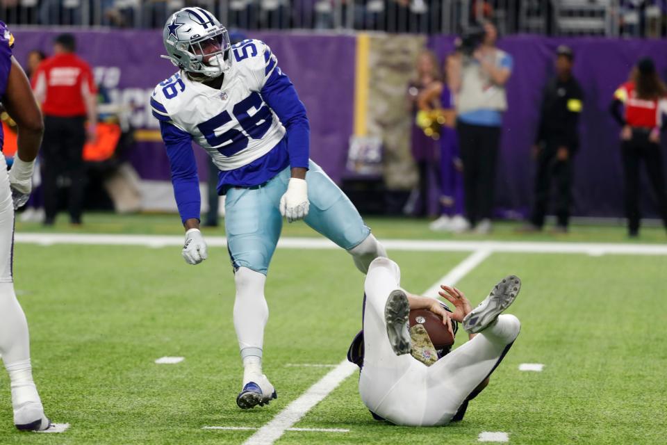 Dallas Cowboys defensive end Dante Fowler Jr. (56) celebrates after sacking Minnesota Vikings quarterback Kirk Cousins during the second half of an NFL football game, Sunday, Nov. 20, 2022, in Minneapolis. (AP Photo/Bruce Kluckhohn)