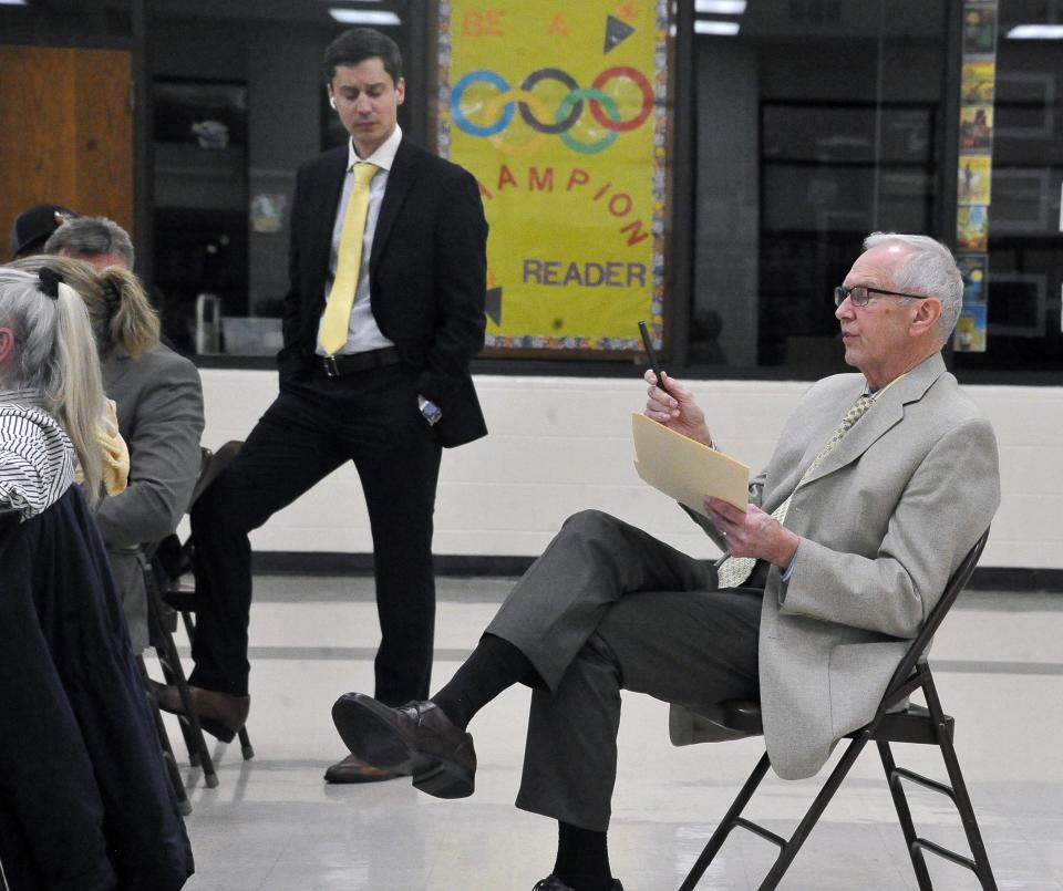 Chippewa School treasurer Ira Hamman answers a question from the audience.