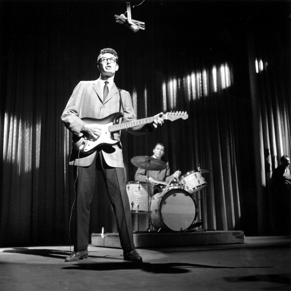 Buddy Holly performing with his band the Crickets — that’s drummer Jerry Allison on the drums — on <em>The</em> <em>Ed Sullivan Show</em> on Jan. 26, 1958. (Photo: Steve Oroz/Michael Ochs Archives/Getty Images)