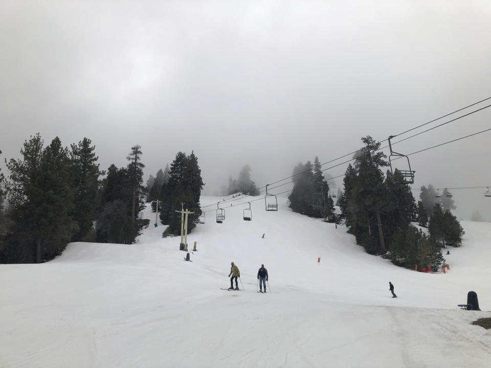 Skiers take to the slopes at Snow Summit ski resort in Big Bear Lake, Calif., on Friday, Feb. 1, 2019. A powerful storm heading toward California is expected to produce heavy rainfall, damaging winds, localized stream flooding and heavy snow in the Sierra Nevada. Forecasters say rain will arrive in the north late Friday afternoon and reach the south late in the night, and last through Saturday night. (AP Photo/Christopher Weber)
