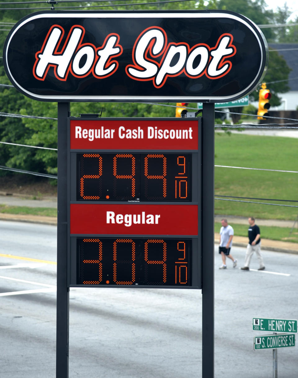 A sign for $2.99 a gallon gasoline is seen as vehicles wait for a traffic light to turn green at a Hot Spot convenience store on the corner of Henry and Converse Streets on Friday, June 1, 2012 in Spartanburg, S.C. Oil prices plunged as bleak reports on U.S. job growth and manufacturing heightened worries about a slowing global economy. (AP Photo/Rainier Ehrhardt)