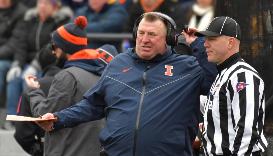 Nov 12, 2022; Champaign, Illinois, USA;  Illinois Fighting Illini head coach Bret Bielema talks with an official during the first half against the Purdue Boilermakers at Memorial Stadium.
