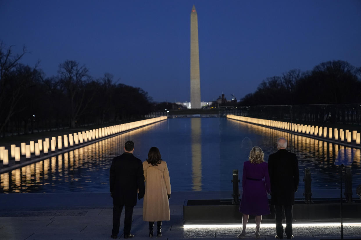 President-elect Joe Biden and his wife Jill Biden, along with Vice President-elect Kamala Harris and her husband, Doug Emhoff, look at lights placed around the Lincoln Memorial Reflecting Pool on Jan. 19, 2021, in Washington.  (Photo: AP Photo/Alex Brandon)