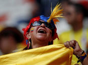 <p>A Colombian soccer team supporter shows his colours </p>