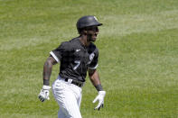 Chicago White Sox's Tim Anderson celebrates his lead off, first pitch home run off Minnesota Twins starting pitcher Michael Pineda during the first inning of a baseball game Thursday, May 13, 2021, in Chicago. (AP Photo/Charles Rex Arbogast)