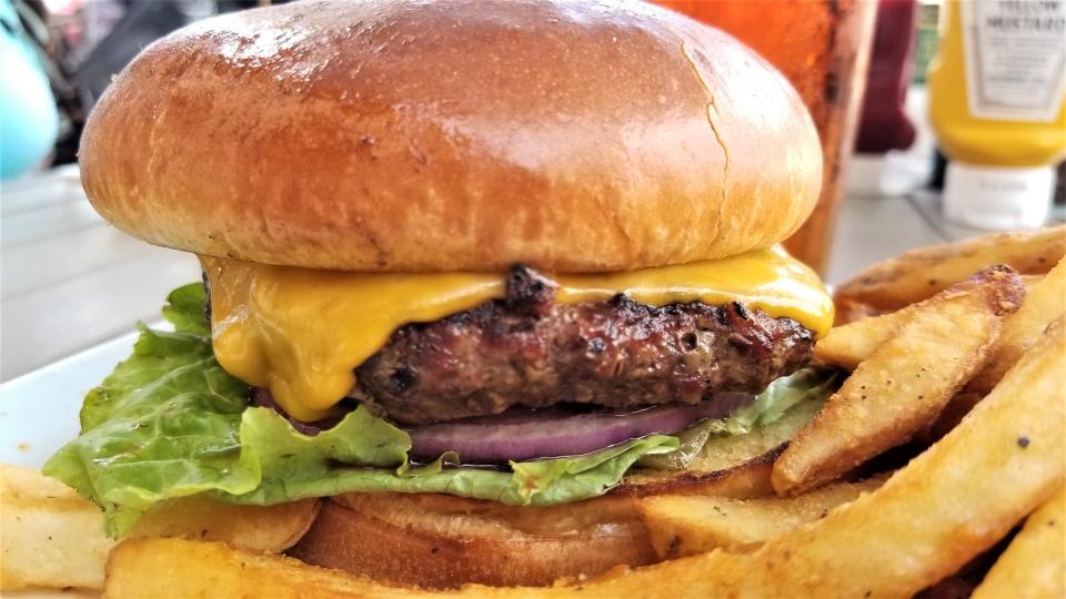 Riviera Dunes Dockside Social Bar & Grill's steak burger with fries and a pint of V Twin – Vienna Lager by Motorworks Brewing in Bradenton photographed May 12, 2023.