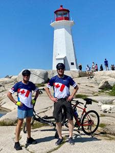 Kevin Mooney, President of Irving Shipbuilding (left) and Greg Thomas, Senior Director of Quality Control at Irving Shipbuilding (right) biked for the cause to Peggy’s Cove, NS in the official 2021 Navy Bike Ride jerseys.