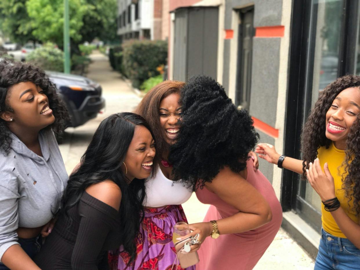 Check out these April Fools' Day jokes, perfect for friends, family, partners and kids. Pictured: A group of Black women laughing and having fun | 