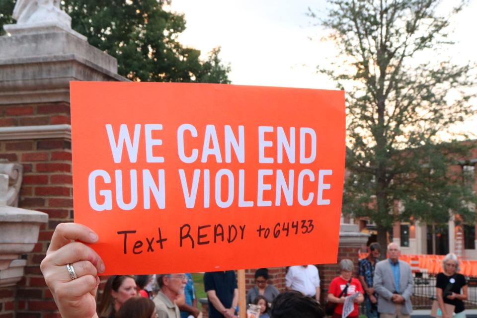 At a Moms Demand Action event, gun reform advocates protest against gun violence on Aug. 5, 2019 at Toomer's Corner Auburn, Ala.