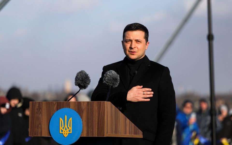 President of Ukraine Volodymyr Zelenskyy performs the national anthem during the launch of traffic on the upper part of the new cable-stayed bridge across the Dnipro River on Unity Day, Zaporizhzhia, southeastern Ukraine. - Future publishing