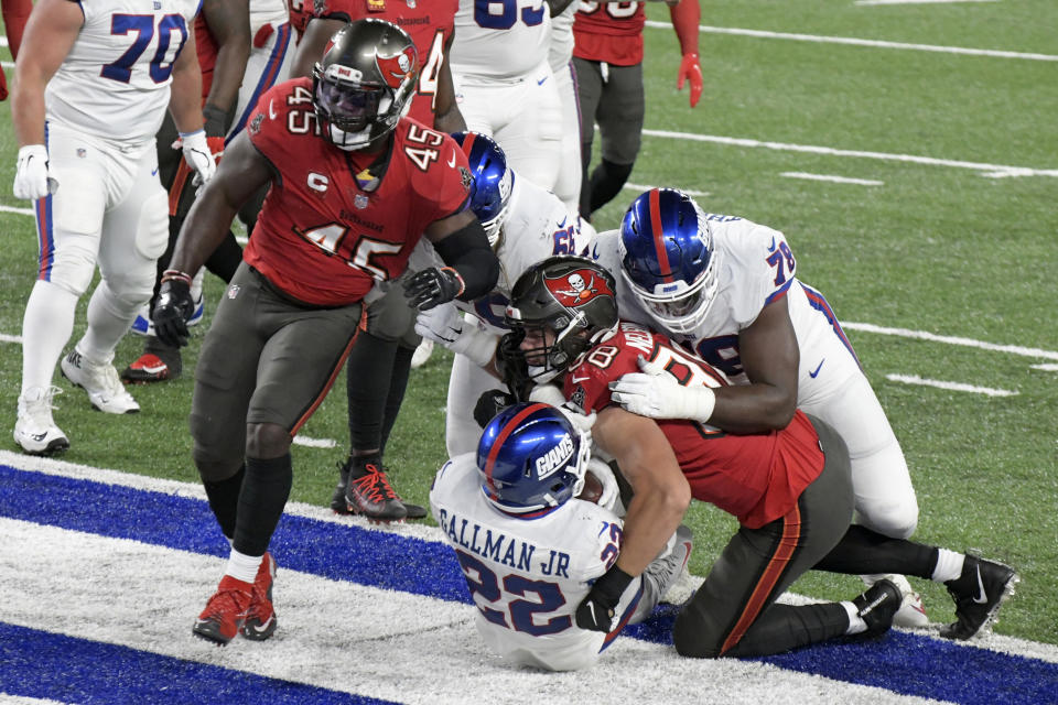 New York Giants' Wayne Gallman (22) scores a touchdown during the first half of an NFL football game against the Tampa Bay Buccaneers, Monday, Nov. 2, 2020, in East Rutherford, N.J. (AP Photo/Bill Kostroun)