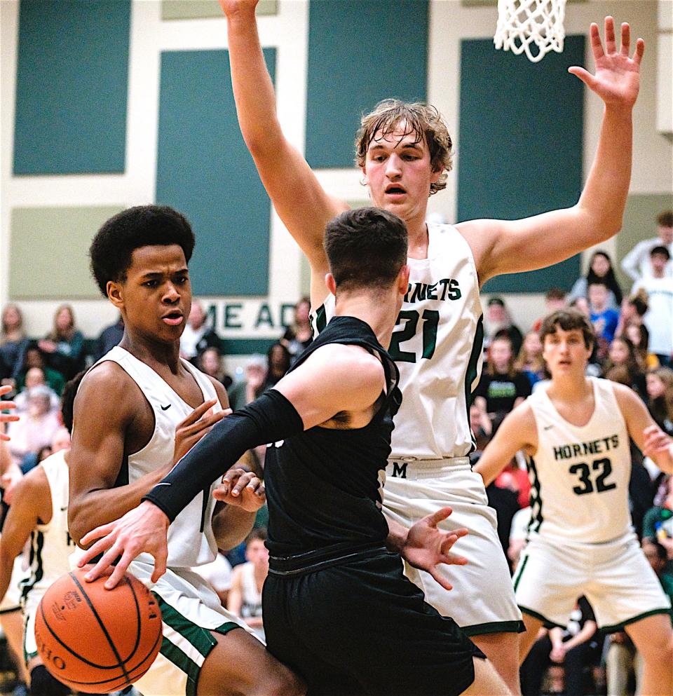 J'Allen Barrino (left) and Michael Minor defend Tusky Central's Zander Sabin.