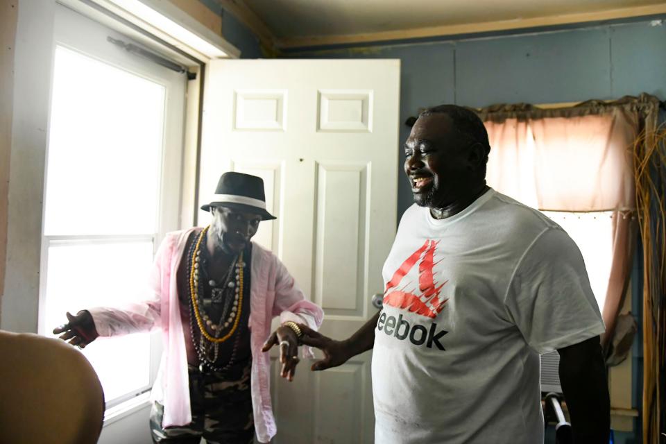 Henry Thomas laughs with his brother, Danny Thomas, as they reminisce on memories growing up, inside of his grandmothers house in Walterboro, S.C., on Saturday, July 1, 2023. Henry and