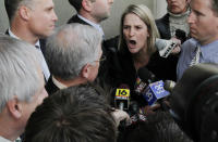 FILE - In this Feb. 18, 2011 file photo, Sandy Fonzo of Wilkes-Barre, right, confronts former Luzerne County Judge Mark A. Ciavarella Jr., as he leaves the federal courthouse in Scranton Pa. Fonzo's son, who was jailed when he was 17 by Ciavarella, committed suicide at the age of 23. The film "Kids for Cash" set to open Wednesday, Feb. 5, 2014 in Philadelphia before opening in theaters nationwide, explores the scandal that entangled thousands of children in Pennsylvania's juvenile court system and sent two former judges to prison. Ciavarella is serving a 28-year sentence and fellow ex-judge Michael Conahan 17 years for taking $2.6 million from companies looking to build and fill a youth detention center for Luzerne County. (AP Photo/The ScrantonTimes-Tribune, Michael J. Mullen, File)