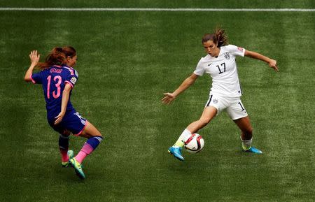 United States midfielder Tobin Heath (17) controls the ball against Japan midfielder Rumi Utsugi (13) during the first half of the final of the FIFA 2015 Women's World Cup at BC Place Stadium. Mandatory Credit: Erich Schlegel-USA TODAY Sports