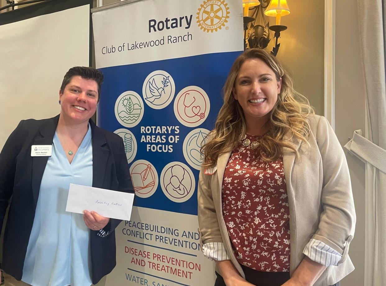 Parenting Matters executive director Katie Becker, left, and marketing director Bridget Harry are all smiles after receiving a Rotary grant that will help fund the Musical Motion program at Oneco Elementary School.