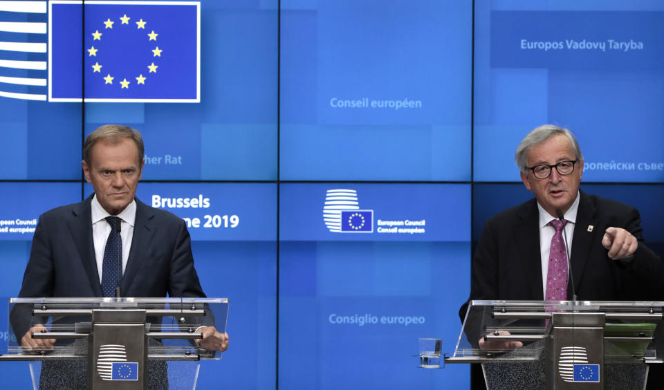 European Council President Donald Tusk, left, and European Commission President Jean-Claude Juncker participate in a media conference at the end of an EU summit in Brussels, Friday, June 21, 2019. EU leaders concluded a two-day summit on Friday in which they discussed, among other issues, the euro-area. (AP Photo/Virginia Mayo)