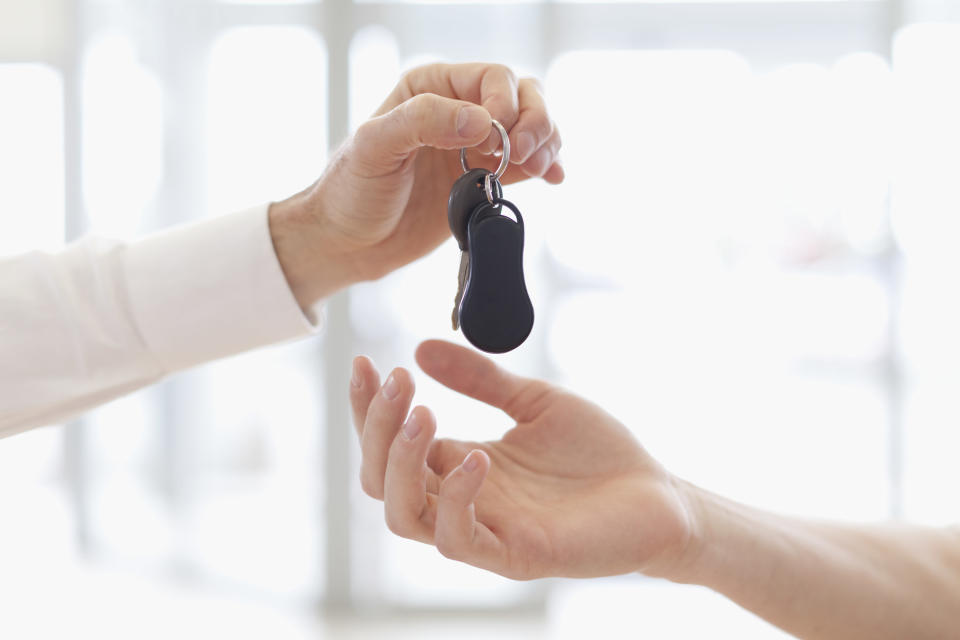 Car keys exchanging hands