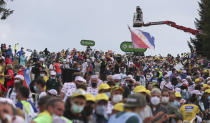 Spectators crowd the climb towards La Planche des Belles Filles as they wait for riders during stage 20 of the Tour de France cycling race, an individual time trial over 36.2 kilometers (22.5 miles), from Lure to La Planche des Belles Filles, France, Saturday, Sept. 19, 2020. (AP Photo/Thibault Camus)