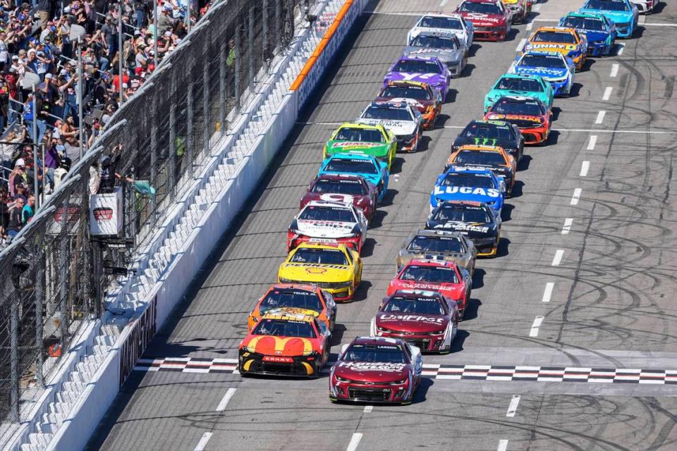 Apr 7, 2024; Martinsville, Virginia, USA; NASCAR Cup Series driver Kyle Larson (5) and driver Bubba Wallace (23) lead the field to the start during the Cook Out 400 at Martinsville Speedway. Jim Dedmon/USA TODAY Sports