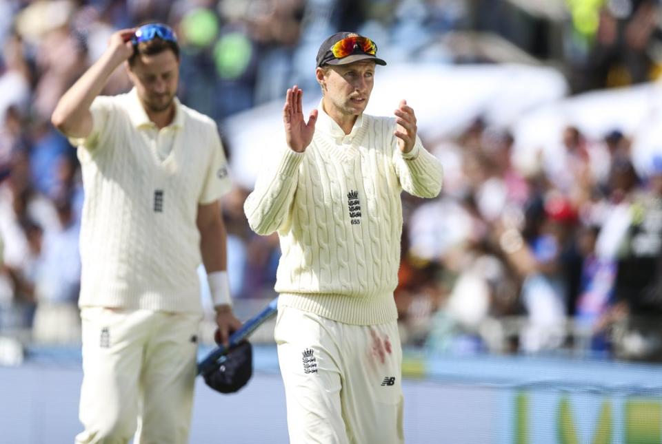 England’s Joe Root (right) claps the fans at Headingley after victory over India in the third Test with man-of-the-match Ollie Robinson alongside him (Nigel French/PA Images). (PA Wire)