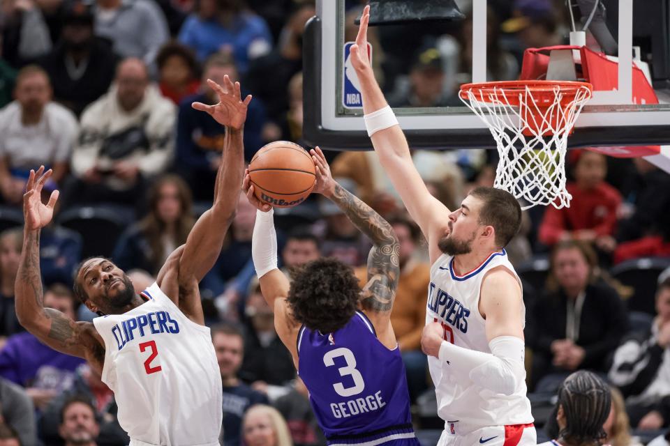 Utah Jazz guard Keyonte George (3) goes up against LA Clippers forward Kawhi Leonard (2) and center Ivica Zubac (40) at the Delta Center in Salt Lake City on Friday, Dec. 8, 2023. | Spenser Heaps, Deseret News