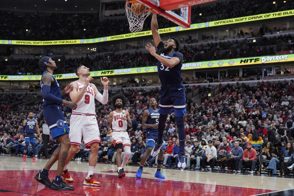 Minnesota Timberwolves center Karl-Anthony Towns dunks against the Chicago Bulls during the first half of an NBA basketball game Tuesday, Feb. 6, 2024, in Chicago. (AP Photo/Erin Hooley)