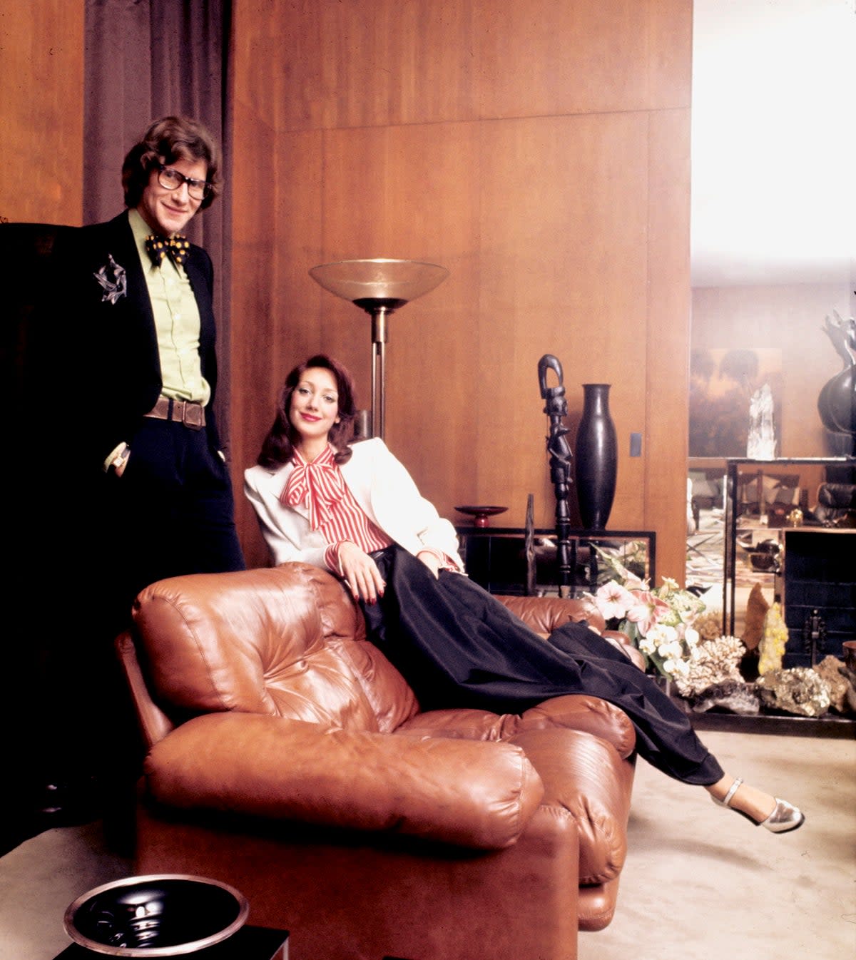 Yves Saint Laurent at his house in Paris with Marisa Berenson - Getty Images (Paris Match via Getty Images)