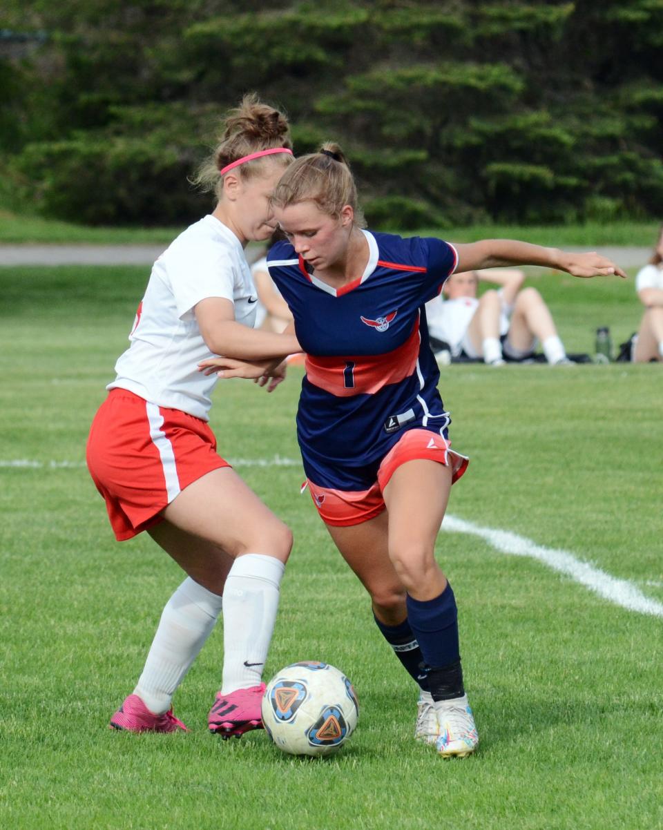 Boyne City's Elly Day makes a move on a Benzie Central player before scoring in the first half.