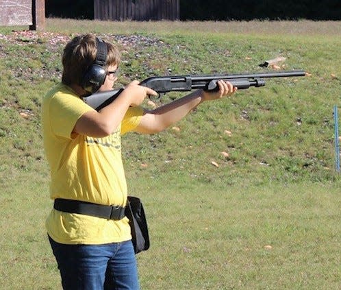 Pellston's Brody Taylor competes in a single shooting clay target event.