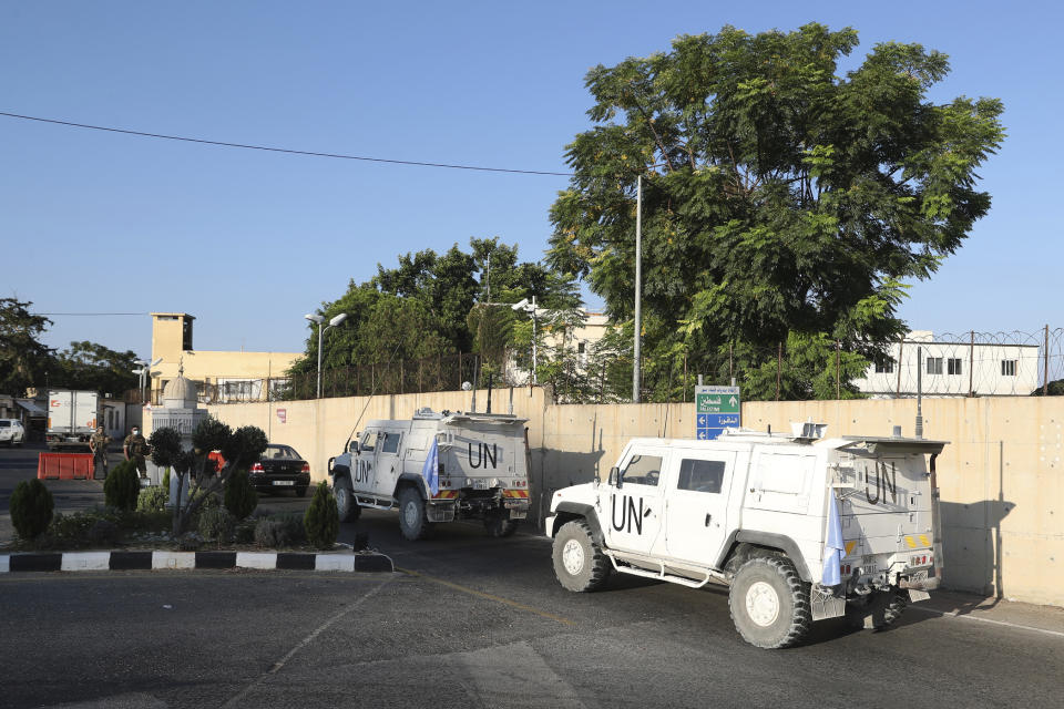 U.N. peacekeeping military vehicles enter the headquarters of the U.N. peacekeeping force in the southern Lebanese border town of Naqoura, Lebanon, Wednesday, Oct. 14, 2020. Lebanon and Israel are to begin Wednesday indirect talks over the disputed maritime border between the two countries in the presence of American officials who are mediating between the Middle Eastern nations. (AP Photo/Bilal Hussein)