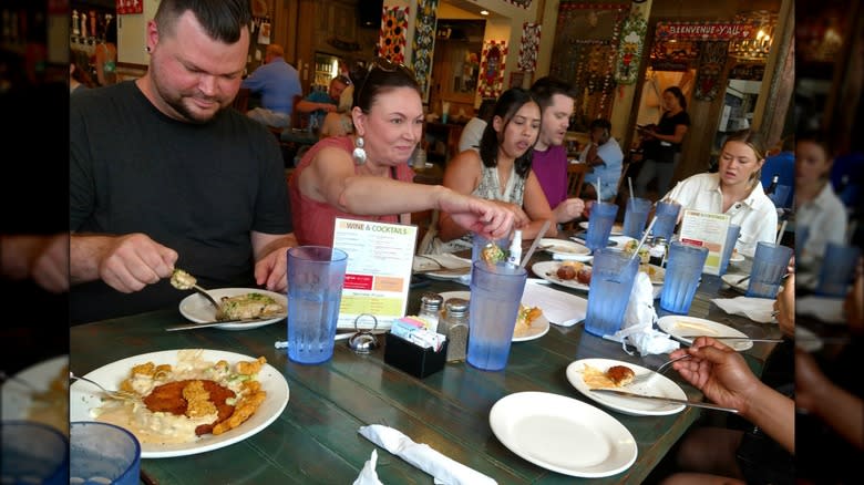 group eating New Orleans food