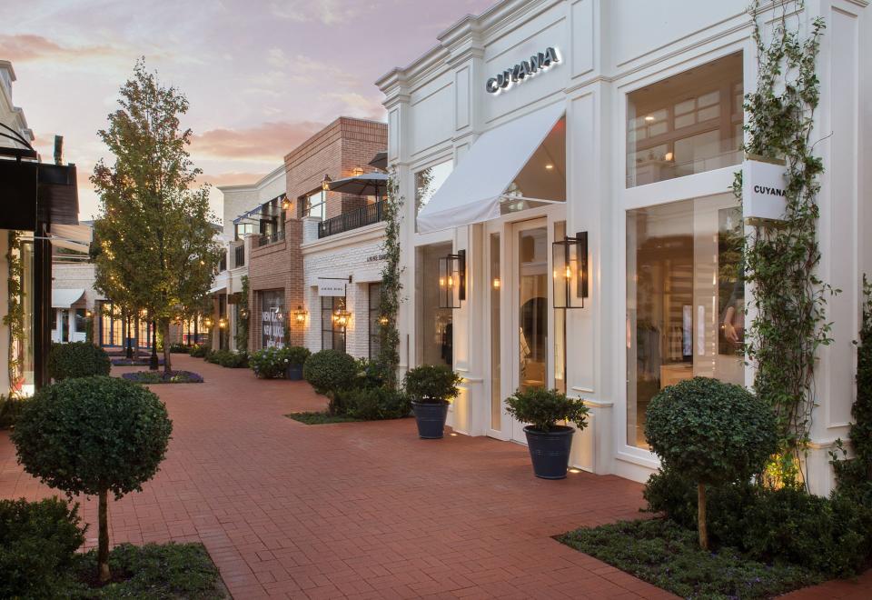 A pedestrian-only brick lane in Palisades Village, where no two adjacent buildings were designed by the same architect.