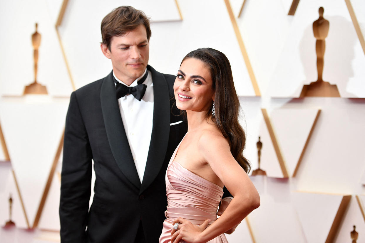 Ashton Kutcher (L) and wife US actress Mila Kunis attend the 94th Oscars (Angela Weiss / AFP via Getty Images)