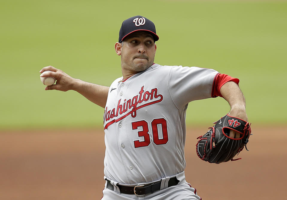 Washington Nationals pitcher Paolo Espino works against the Atlanta Braves in the first inning of a baseball game Sunday, July 10, 2022, in Atlanta. (AP Photo/Ben Margot)