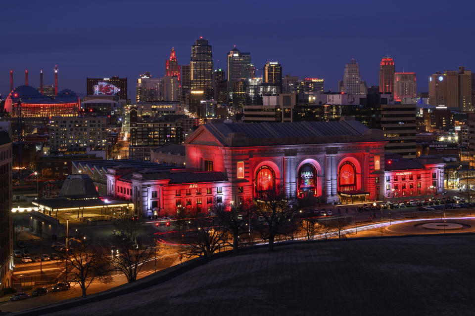 With the Kansas City Chiefs headed to the Super Bowl, downtown is lit red, including Union Station, in the foreground, on Sunday, Feb. 5, 2023, in Kansas City, Mo. (AP Photo/Reed Hoffmann)