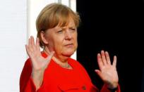 German Chancellor Angela Merkel gestures as she welcomes representatives of the European Round Table of Industrialists (ERT) in Meseberg, Germany, June 19, 2018. REUTERS/Hannibal Hanschke