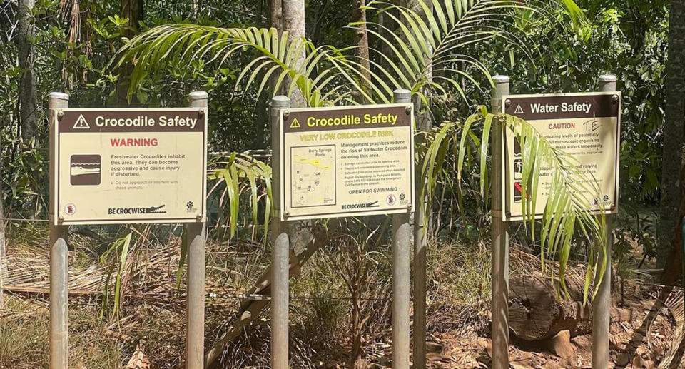 Signs warning people at Berry Springs of the freshwater crocodiles present as well as other dangers.