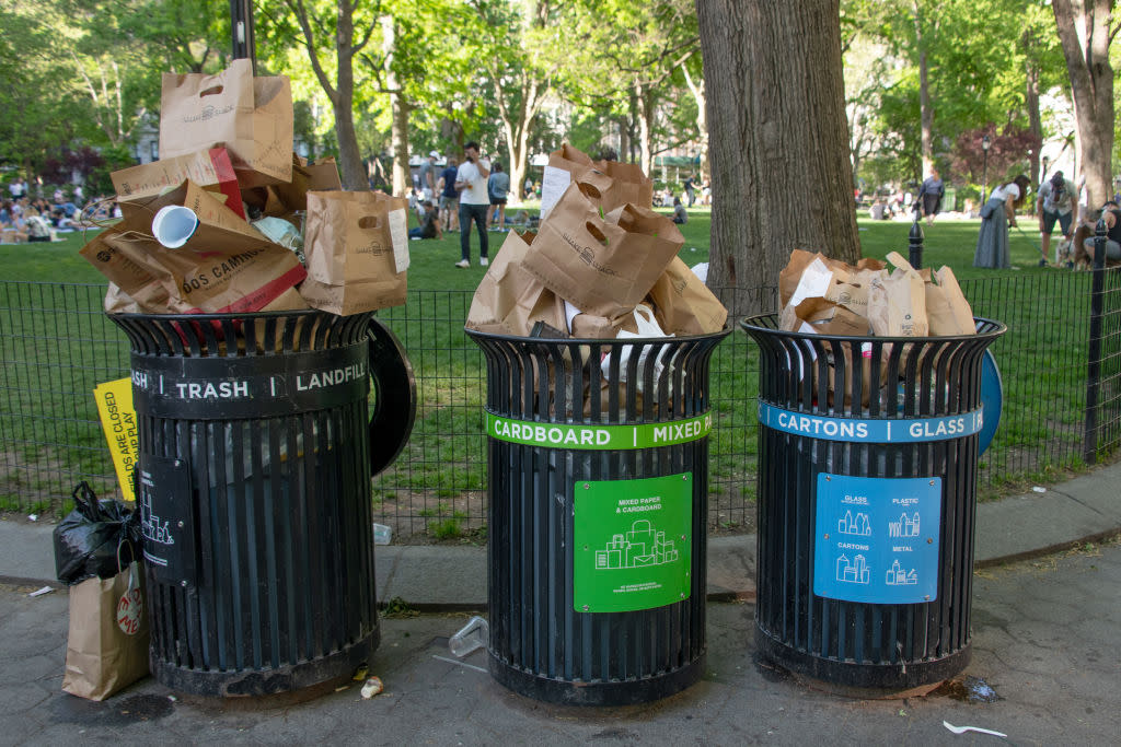 Trash bins overflow with recyclable paper bags on May 16, 2020 in New York City.