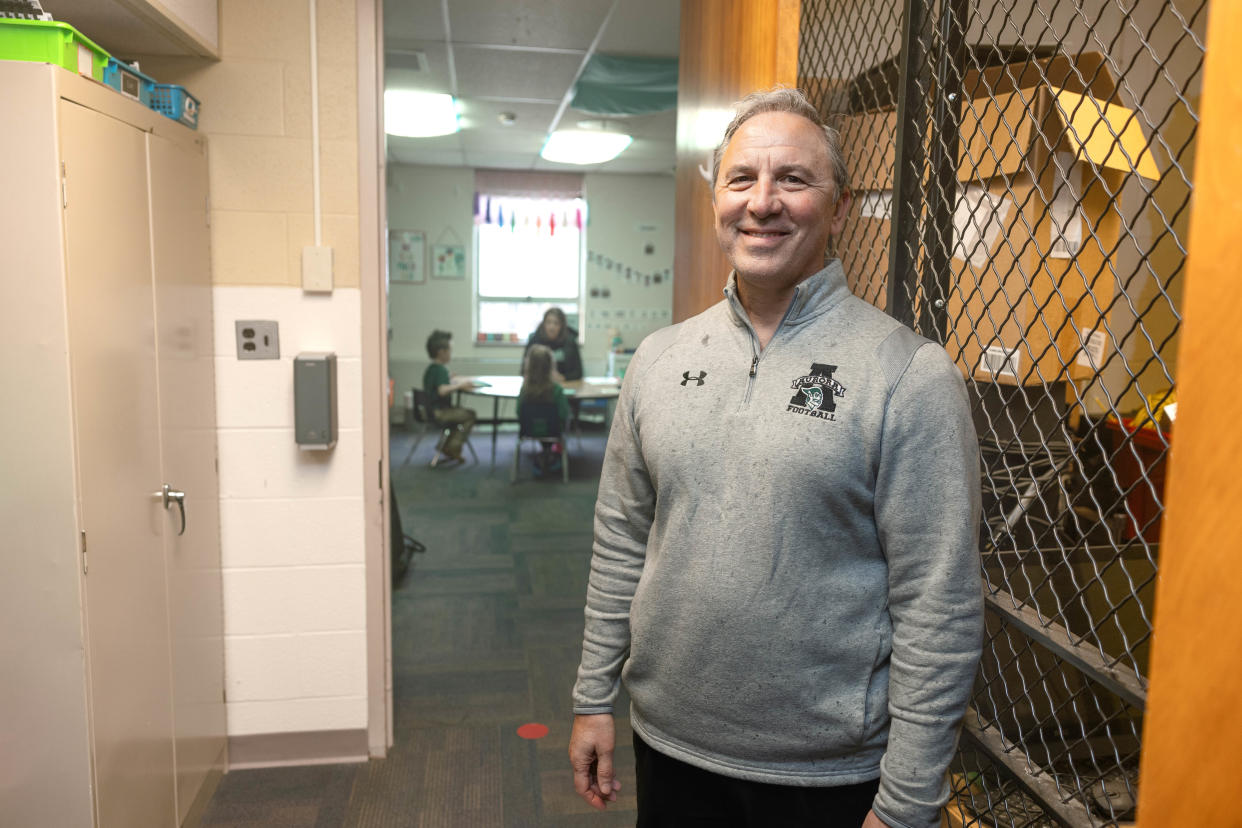 Aurora City Schools superintendent Mike Roberto stands in a storage closet that now serves as a small classroom inside the district’s Miller Elementary School.