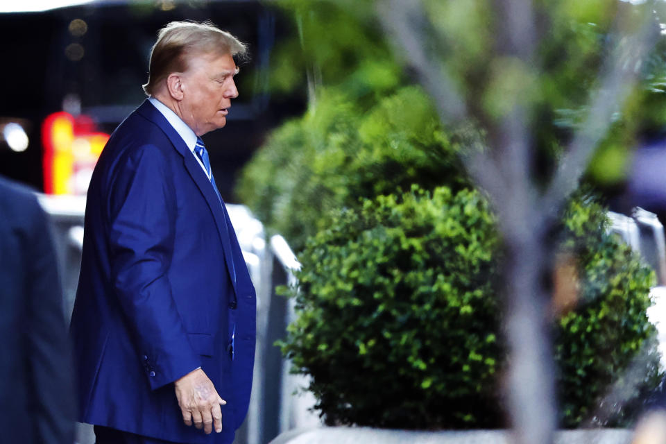 Former President Donald Trump, leaves Trump Tower for Manhattan Criminal Court Tuesday, April 16, 2024, in New York. Trump is set to return to court as a judge works to find a panel of jurors who'll decide whether the former president is guilty of criminal charges alleging he falsified business records to cover up a sex scandal during the 2016 campaign. (AP Photo/Noah K. Murray)