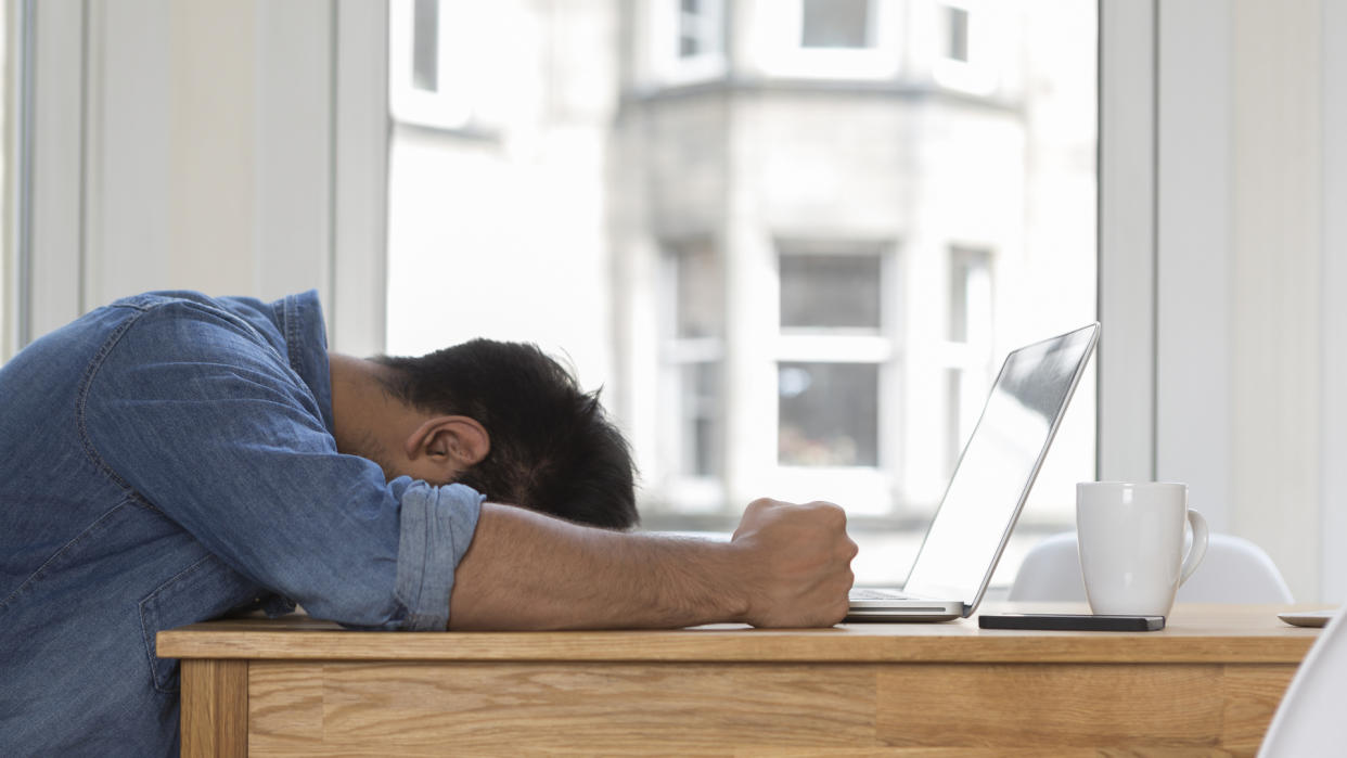  Man upset using a Windows 10 laptop 