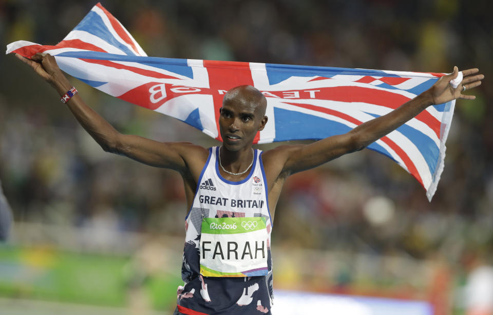 FILE - Britain's Mo Farah celebrates winning the gold medal in the men's 10,000-meter final during the athletics competitions of the 2016 Summer Olympics at the Olympic stadium in Rio de Janeiro, Brazil, Saturday, Aug. 13, 2016. Four-time Olympic champion Mo Farah has disclosed he was brought into Britain illegally from Djibouti under the name of another child. The British athlete made the revelation in a BBC documentary. (AP Photo/Kirsty Wigglesworth, File)