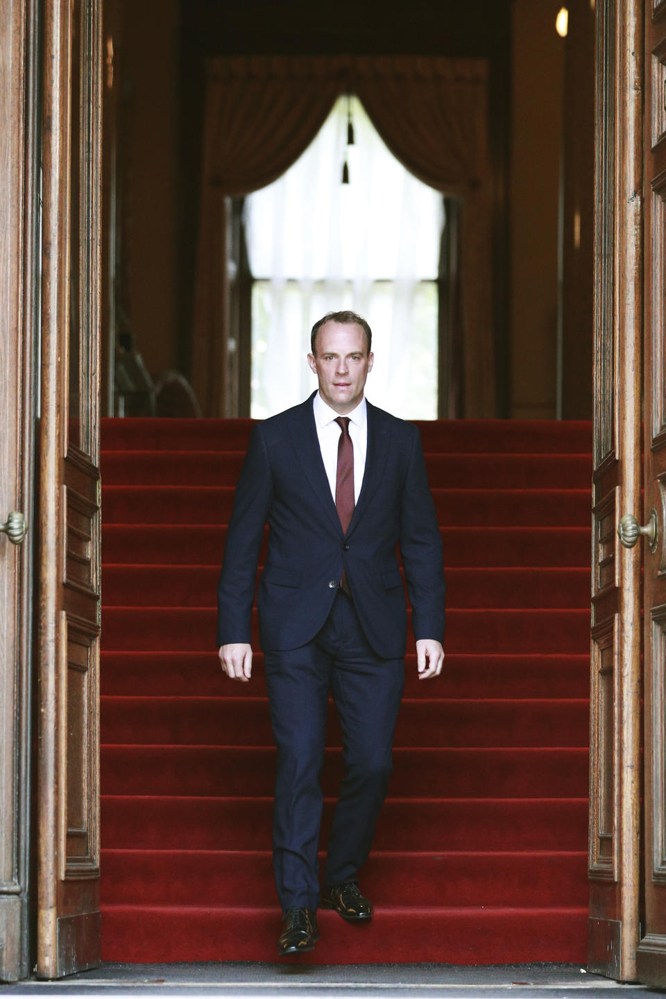 Conservative lawmkaer Dominic Raab is seen at the Foreign and Commonwealth building after being appointed as the Foreign Secretary by new Prime Minister Boris Johnson, on Wednesday, July 24, 2019 in London. Dominic Raab has been named Britain's foreign secretary, the country's top diplomat and one of the most senior roles in government. Raab is a former Brexit secretary and a staunch supporter of Britain's exit from the European Union. (Dan Kitwood/Pool Photo via AP)