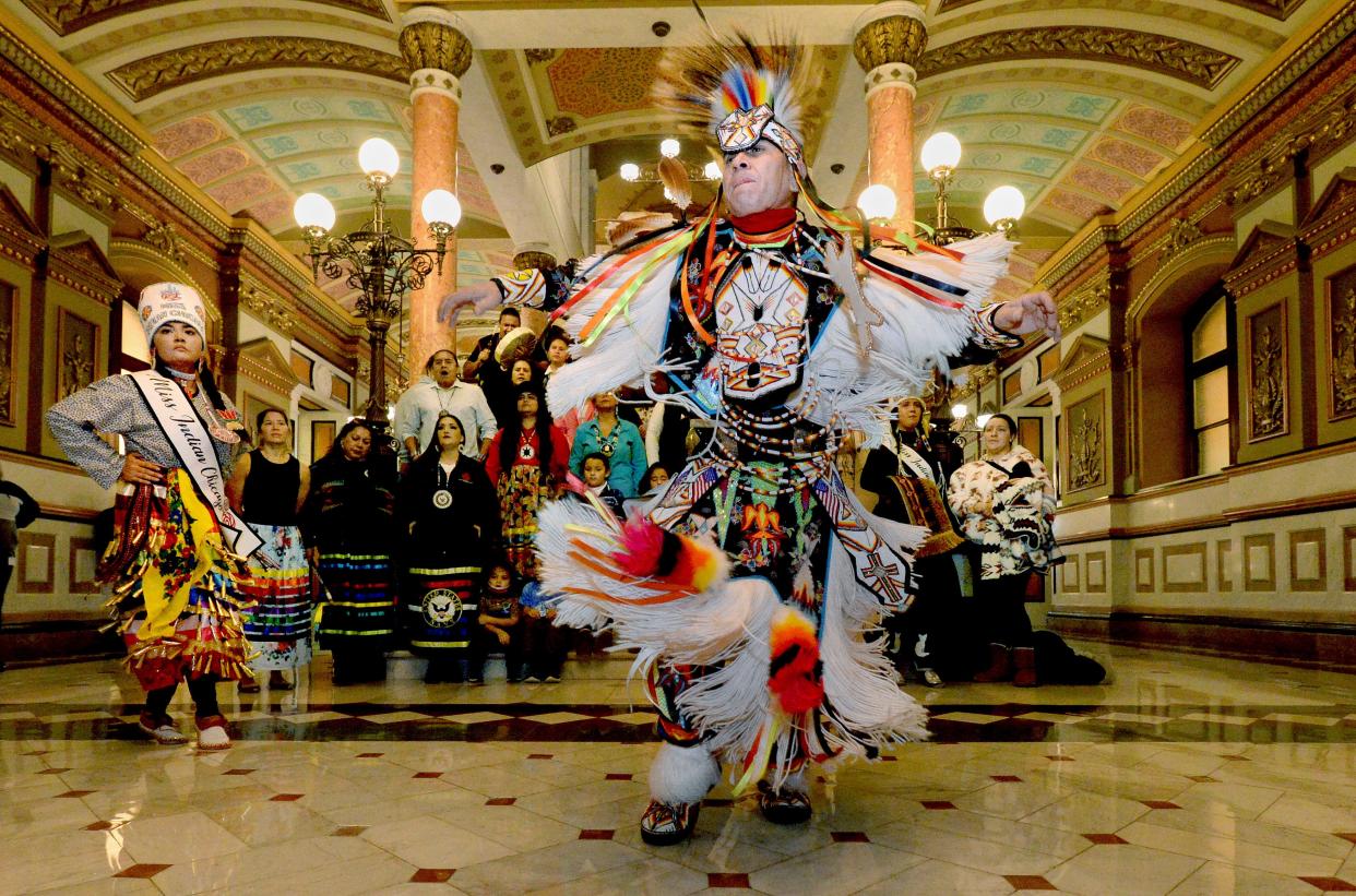 Ronnie Preston of Chicago, front, performs a tradition American Native Dance with Nizhoni Ward, 17, left, also of Chicago, on Wednesday Nov. 16, 2022 in the rotunda of the state Capitol while other Native Americans behind them sing and play drums. They were in Springfield with the Chicago American Indian Community Collaborative to advocate for Native American concerns.