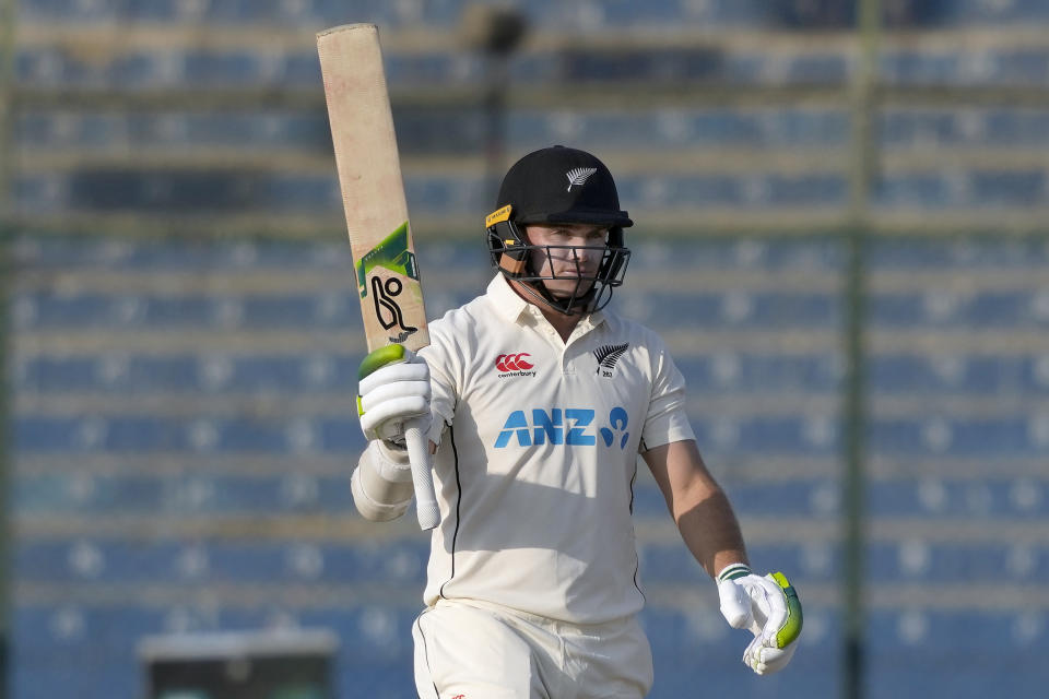 New Zealand's Tom Latham celebrates after scoring fifty during the second day of first test cricket match between Pakistan and New Zealand, in Karachi, Pakistan, Tuesday, Dec. 27, 2022. (AP Photo/Fareed Khan)