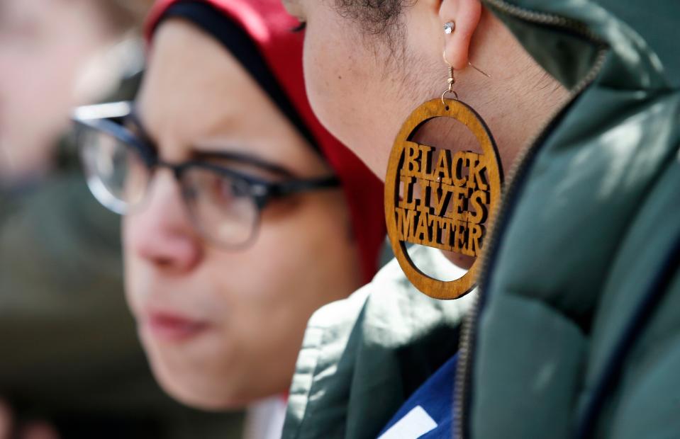 <p>Harvard University student Cecilia Nunez wears a Black Lives Matter earring during a rally against school shootings and gun violence on the steps of Widener Library on campus in Cambridge, Mass., Friday, April 20, 2018. Protests were planned across the country Friday, on the 19th anniversary of the Columbine High School shooting. (Photo: Michael Dwyer/AP) </p>