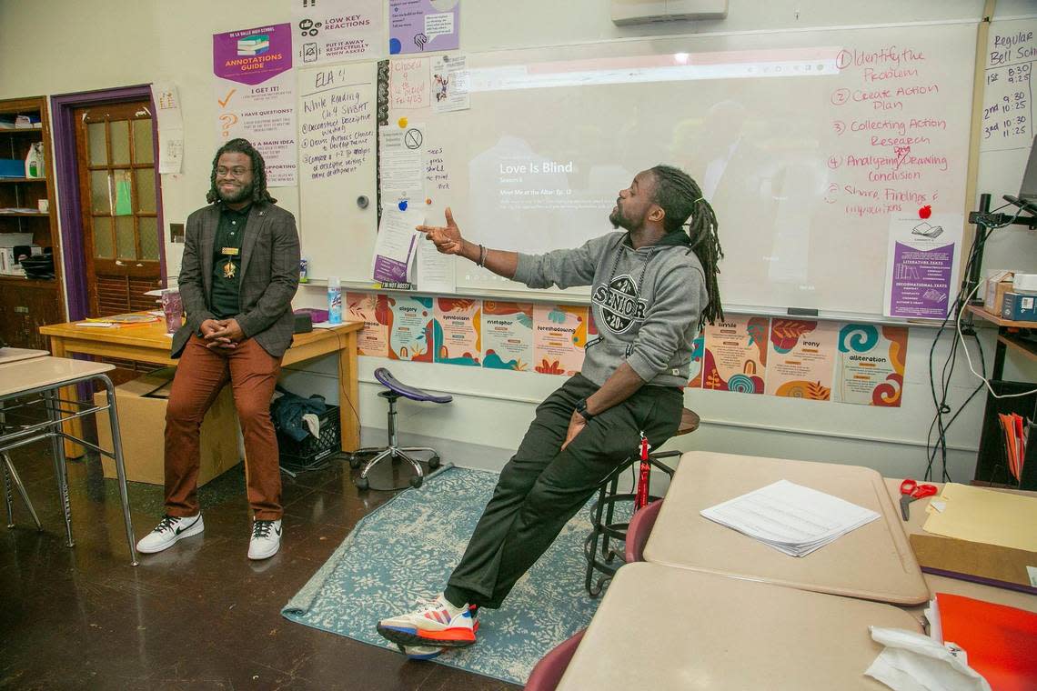 Cornell Ellis, (left) executive director of BLOC, which stands for Brothers Liberating Our Community, visited the classroom of English Language teacher Julian Johnson-Marshall (right) at De La Salle Education Center, 3737 Troost Ave, Kansas City, MO. Ellis supports Black male educators and wants to see more of them in our schools. Susan Pfannmuller/ Special to The Star