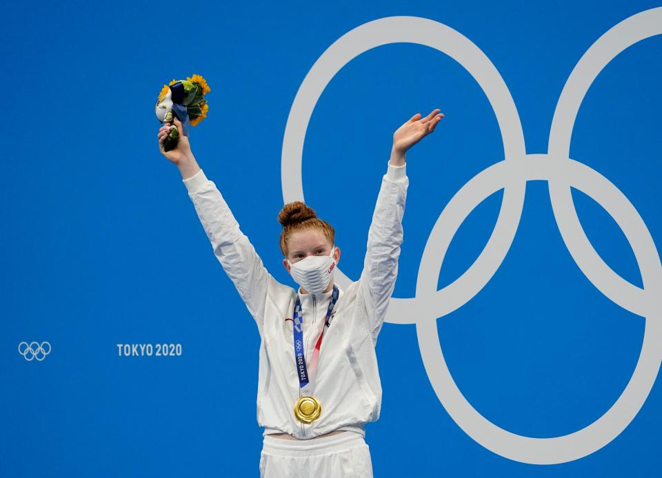 Lydia Jacoby enjoys her moment on the Olympic podium after winning the women's 100-meter breaststroke in last year's Summer Olympics in Tokyo. She has been committed to swim for Texas since November 2020.