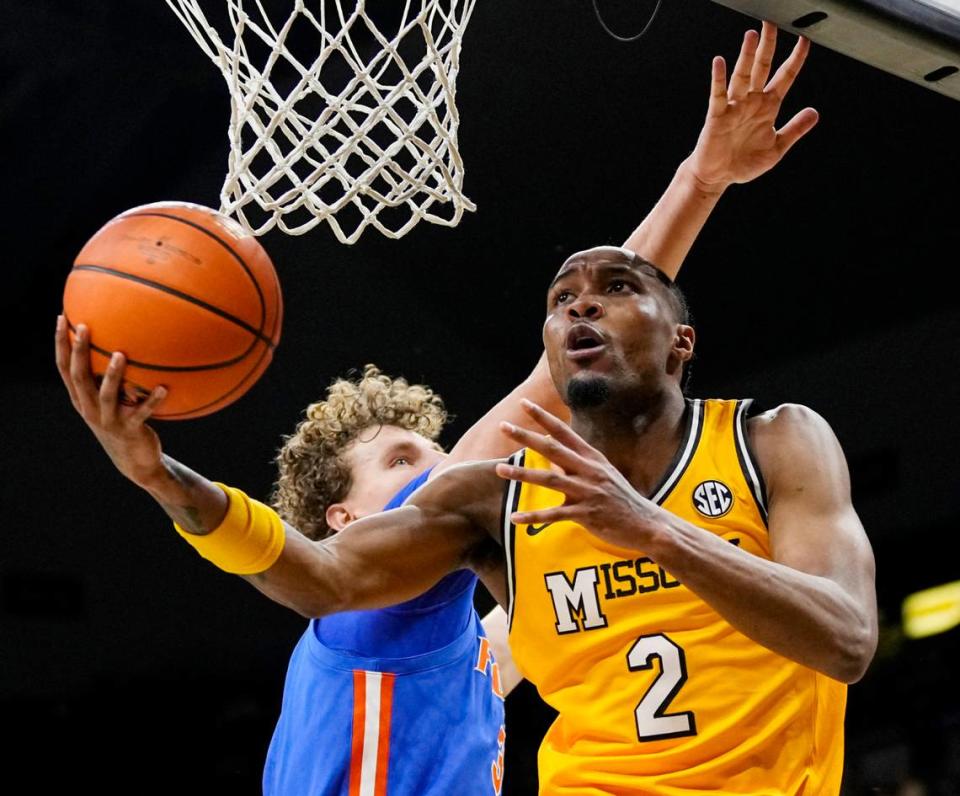 Missouri Tigers guard Tamar Bates (2) shoots against Florida center Micah Handlogten (3) during the first half at Mizzou Arena on Jan. 20, 2024.